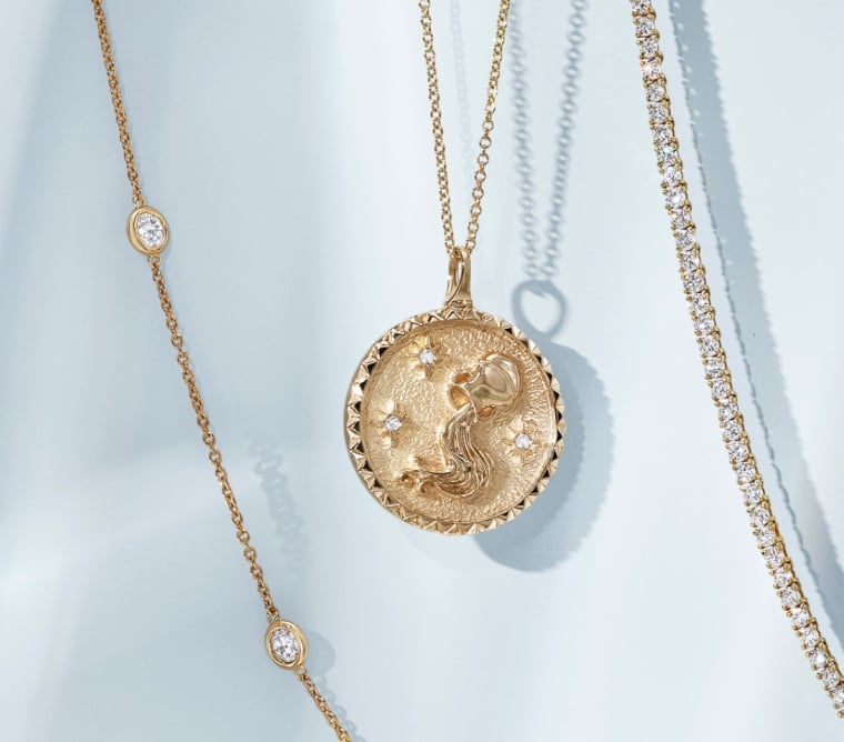 Assortment of gold, zodiac and diamond necklaces.